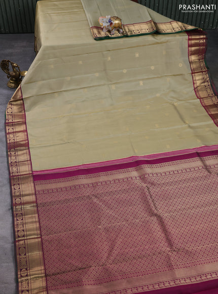 Pure kanchipuram silk saree pastel green and magenta pink with allover zari woven buttas and zari woven korvai border