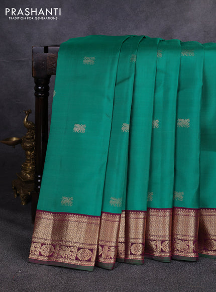 Pure kanchipuram silk saree green and magenta pink with allover zari woven buttas and zari woven korvai border