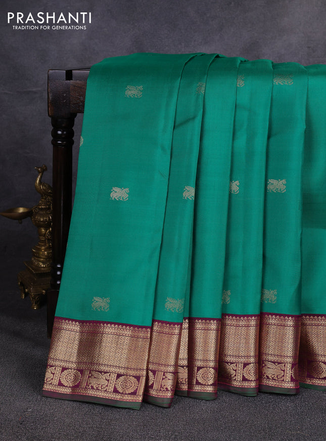 Pure kanchipuram silk saree green and magenta pink with allover zari woven buttas and zari woven korvai border