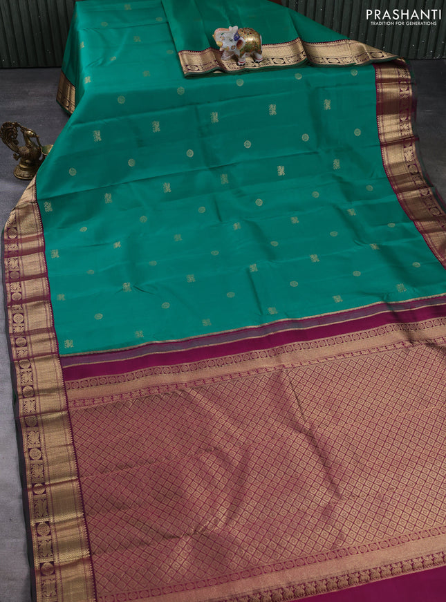 Pure kanchipuram silk saree green and magenta pink with allover zari woven buttas and zari woven korvai border