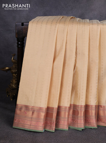 Pure kanchipuram silk saree beige and green with allover zari woven buttas and zari woven border