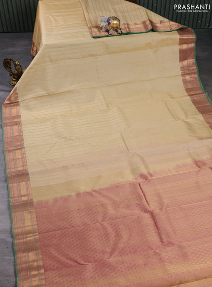 Pure kanchipuram silk saree beige and green with allover zari woven buttas and zari woven border