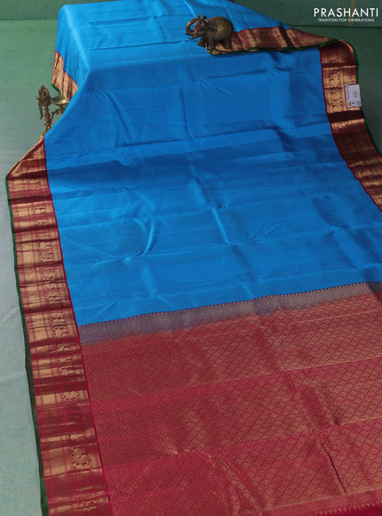 Pure kanchipuram silk saree cs blue and maroon with allover stripe pattern and zari woven korvai border