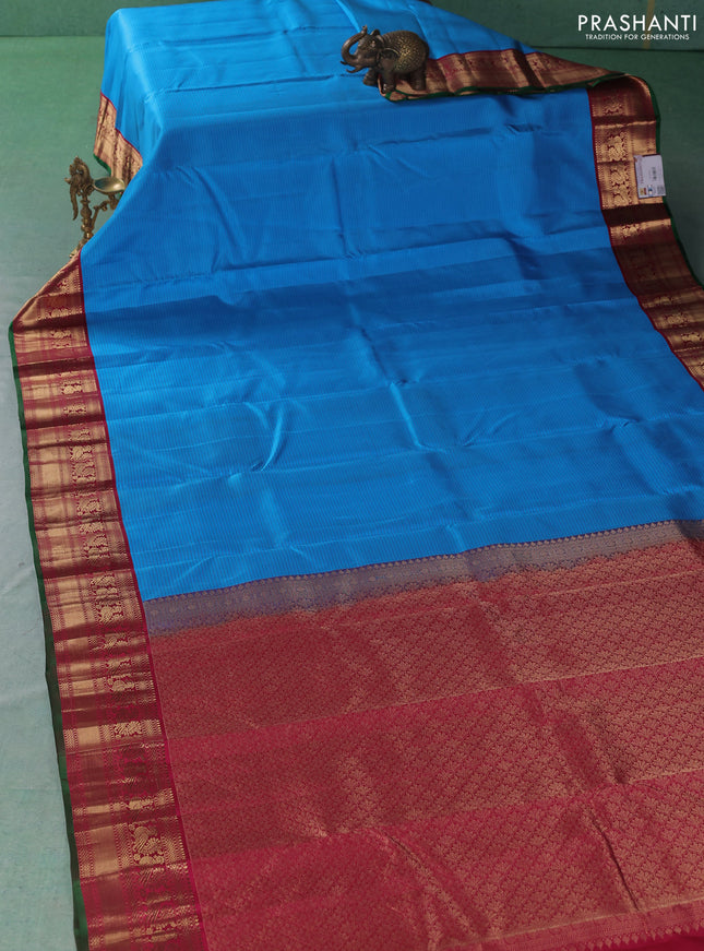 Pure kanchipuram silk saree cs blue and maroon with allover stripe pattern and zari woven korvai border