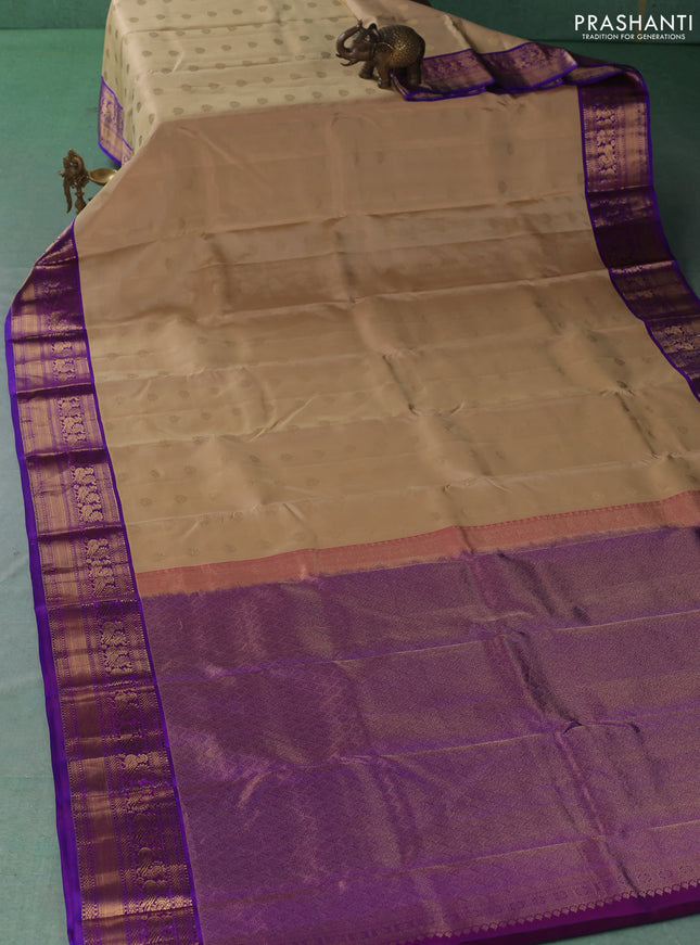 Pure kanchipuram silk saree beige and royal blue with zari woven buttas and zari woven korvai border