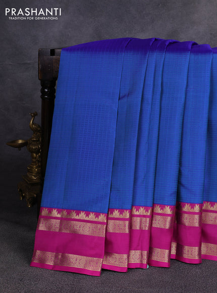 Pure kanchipuram silk saree blue shade and magenta pink with allover checked pattern and rettapet zari woven border
