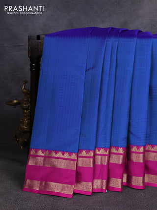 Pure kanchipuram silk saree blue shade and magenta pink with allover checked pattern and rettapet zari woven border