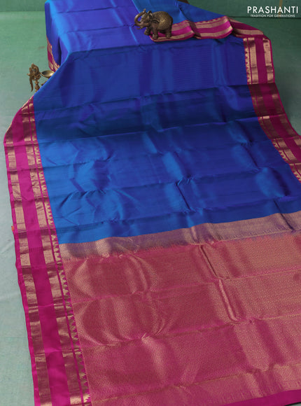 Pure kanchipuram silk saree blue shade and magenta pink with allover checked pattern and rettapet zari woven border