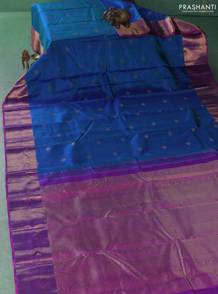 Pure kanchipuram silk saree dual shade of bluish green and pink with zari woven buttas and zari woven korvai border