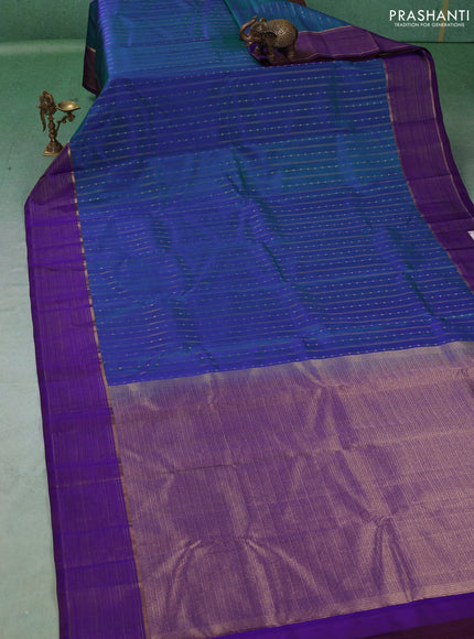 Pure kanchipuram silk saree dual shade of bluish green and violet with allover zari weaves & buttas and zari woven border