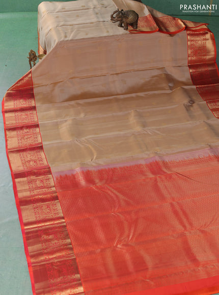 Pure kanchipuram silk saree beige and orange with allover zari woven buttas and long zari woven korvai border