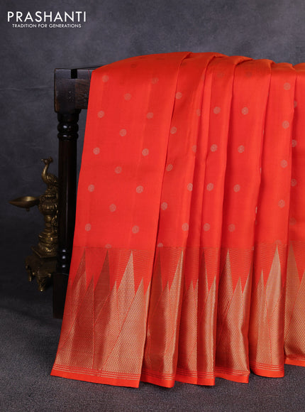Pure kanchipuram silk saree orange with allover zari woven buttas and temple design zari woven border