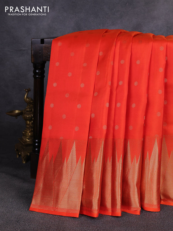 Pure kanchipuram silk saree orange with allover zari woven buttas and temple design zari woven border