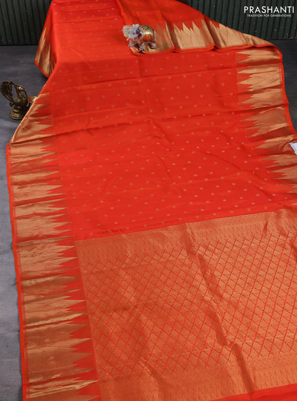 Pure kanchipuram silk saree orange with allover zari woven buttas and temple design zari woven border