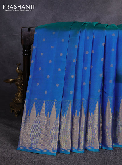 Pure kanchipuram silk saree dual shade of bluish green with allover zari woven buttas and temple design zari woven border