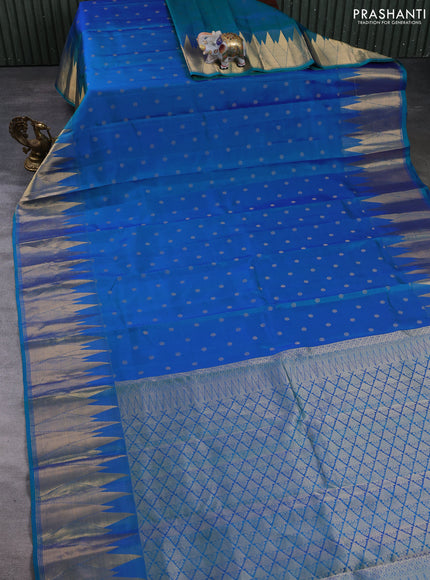 Pure kanchipuram silk saree dual shade of bluish green with allover zari woven buttas and temple design zari woven border