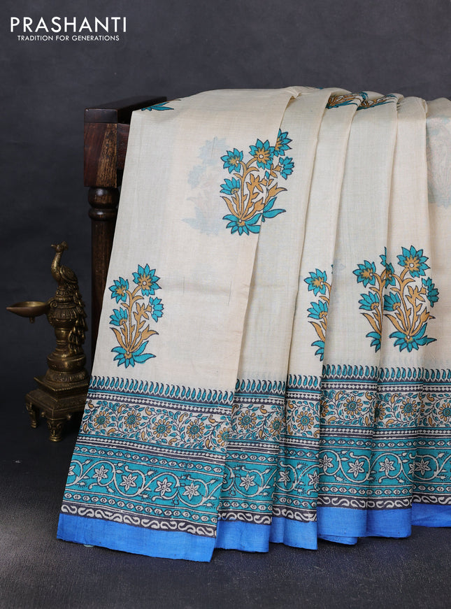 Pure tussar silk saree cream and cs blue with floral butta block prints and long blocked printed border