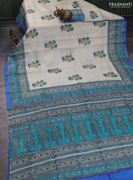 Pure tussar silk saree cream and cs blue with floral butta block prints and long blocked printed border