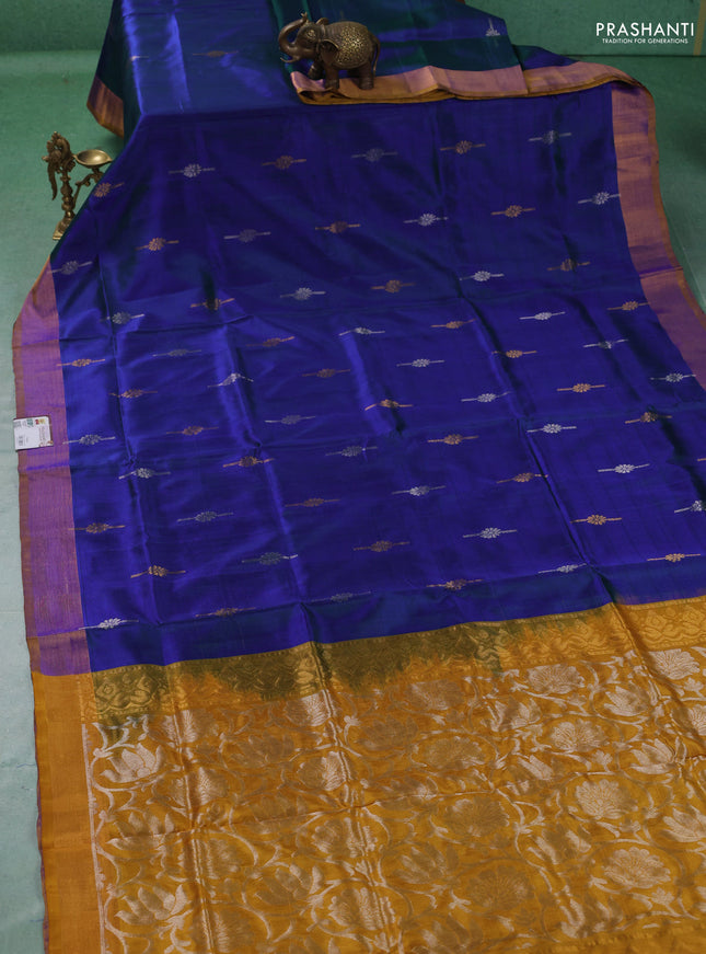 Pure uppada silk saree dual shade of bluish green and mustard yellow with allover silver & gold zari woven buttas and zari woven border