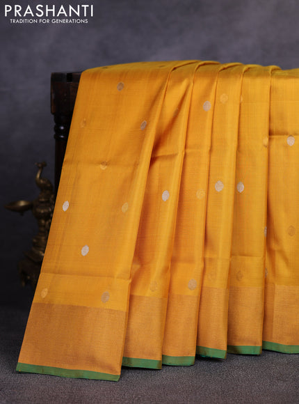 Pure uppada silk saree mustard yellow and green with allover silver zari woven coin buttas and zari woven border
