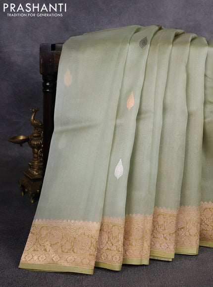 Banarasi organza saree pista green with silver & gold zari woven buttas and zari woven border