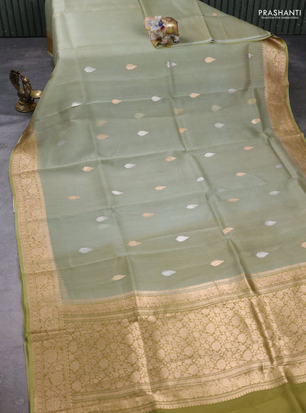 Banarasi organza saree pista green with silver & gold zari woven buttas and zari woven border
