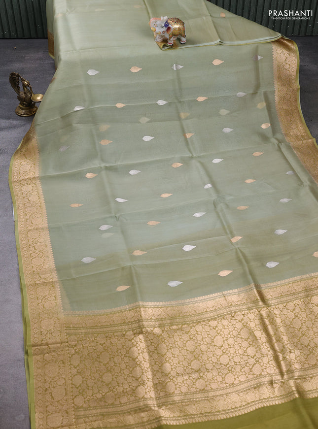 Banarasi organza saree pista green with silver & gold zari woven buttas and zari woven border