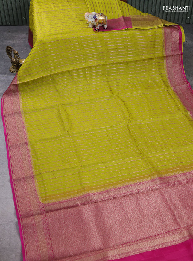 Banarasi organza saree lime green and pink with allover zari weaves and banarasi style border