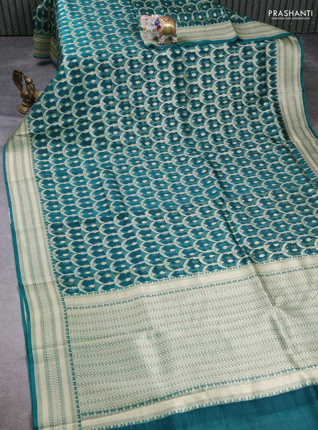 Banarasi organza saree teal green with allover zari weaves and banarasi style border