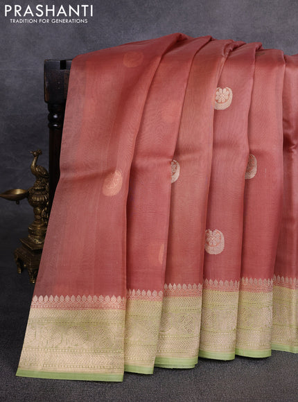Banarasi organza saree peach shade and pista green with zari woven buttas and zari woven border