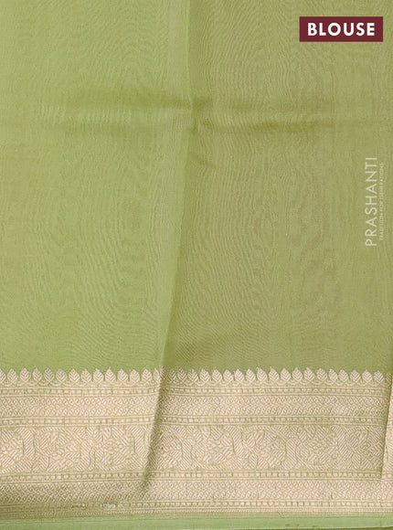 Banarasi organza saree peach shade and pista green with zari woven buttas and zari woven border