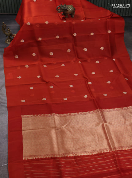 Banarasi organza saree orange with zari woven buttas in borderless style