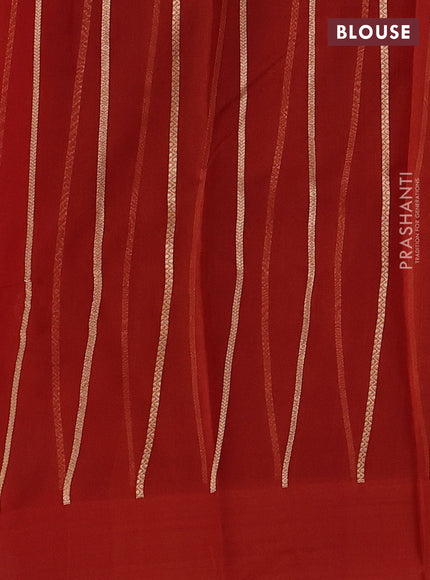 Banarasi organza saree orange with zari woven buttas in borderless style