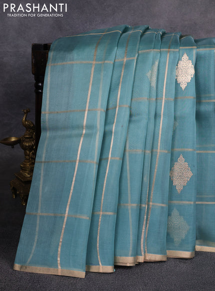 Banarasi organza saree pastel blue with allover zari checks & buttas and zari woven piping border