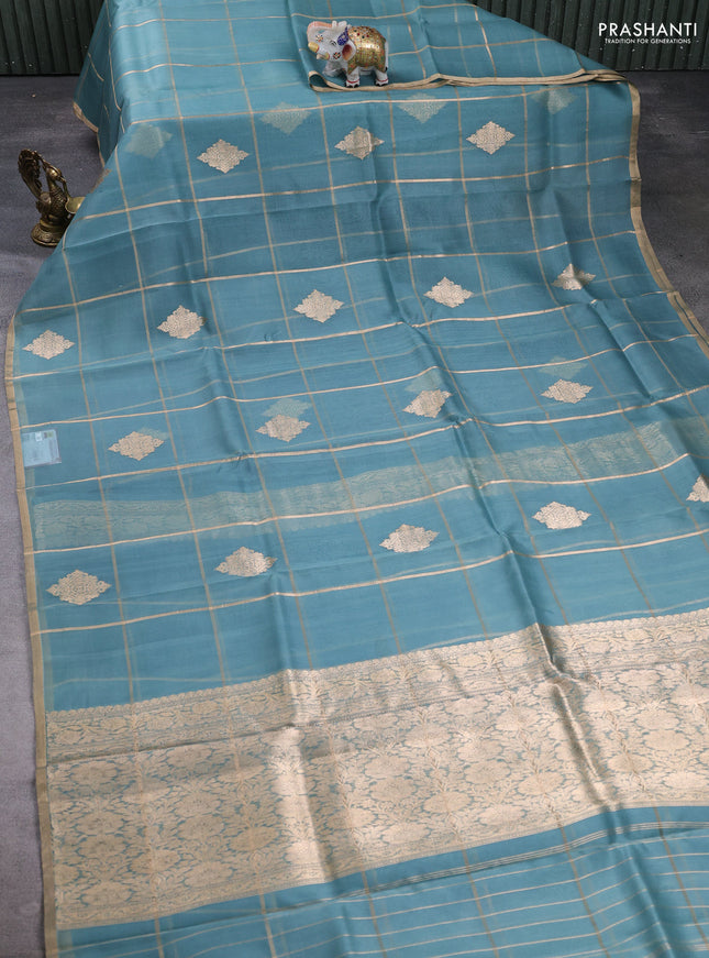 Banarasi organza saree pastel blue with allover zari checks & buttas and zari woven piping border