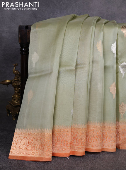 Banarasi organza saree pastel green and orange with zari woven buttas and zari woven border