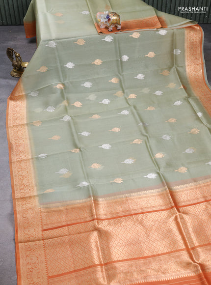 Banarasi organza saree pastel green and orange with zari woven buttas and zari woven border