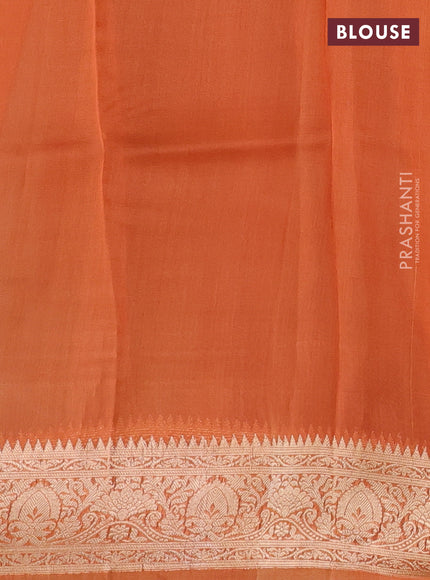 Banarasi organza saree pastel green and orange with zari woven buttas and zari woven border