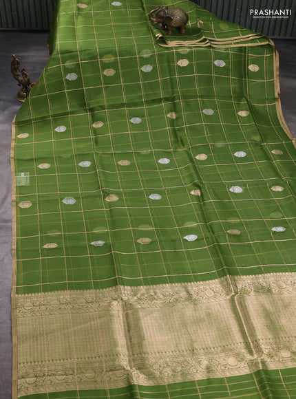 Banarasi organza saree light green with allover zari checks & buttas and zari woven piping border