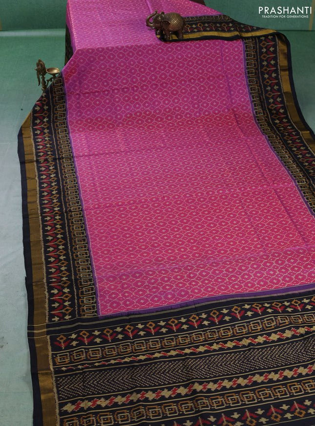 Rajkot patola silk saree dual shade of pink and black with allover ikat weaves and ikat woven zari border