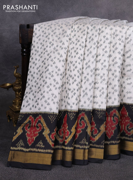 Rajkot patola silk saree off white and black with allover ikat weaves and ikat woven zari border
