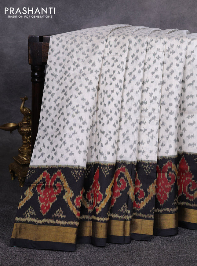 Rajkot patola silk saree off white and black with allover ikat weaves and ikat woven zari border
