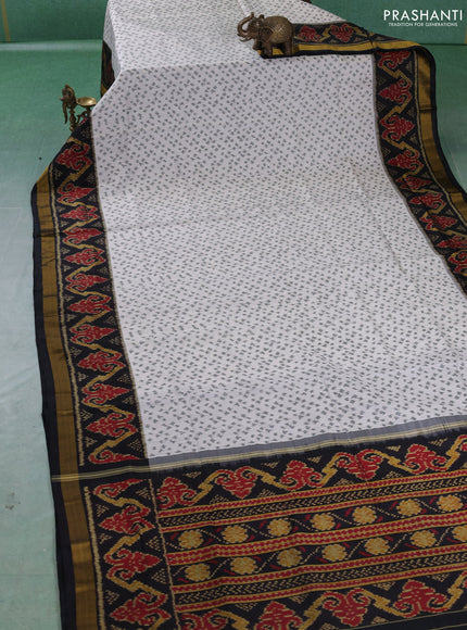 Rajkot patola silk saree off white and black with allover ikat weaves and ikat woven zari border