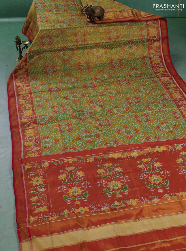 Rajkot patola tissue silk saree green and rust shade maroon with allover ikat weaves and ikat woven zari border