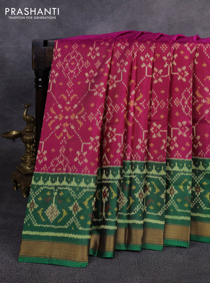 Rajkot patola silk saree dark pink and green blue with allover ikat weaves and ikat woven zari border