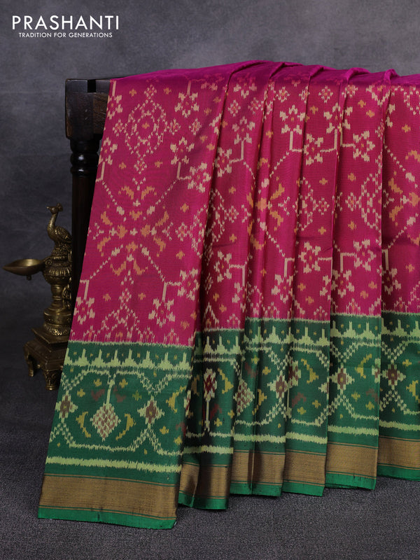 Rajkot patola silk saree dark pink and green blue with allover ikat weaves and ikat woven zari border
