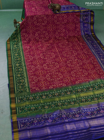 Rajkot patola silk saree dark pink and green blue with allover ikat weaves and ikat woven zari border