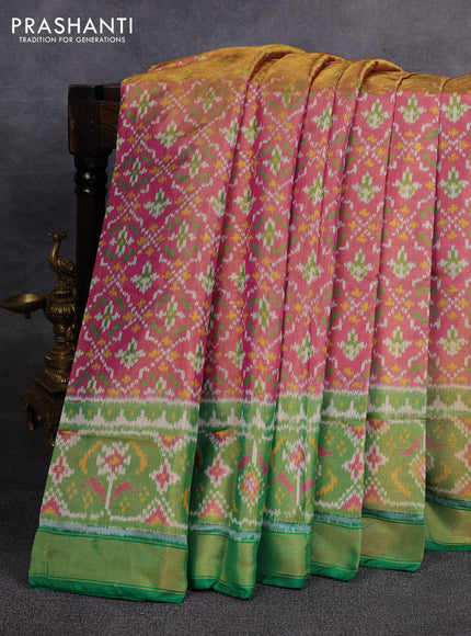 Rajkot patola tissue silk saree pink and green with allover ikat weaves and ikat woven border