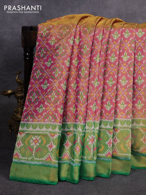 Rajkot patola tissue silk saree pink and green with allover ikat weaves and ikat woven border