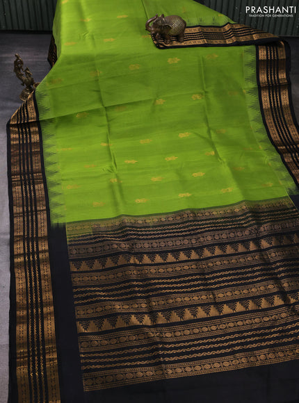 Kuppadam silk cotton saree light green and black with zari woven buttas and temple design zari woven border